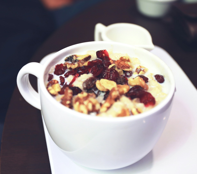 white ceramic mug with brown and black food
